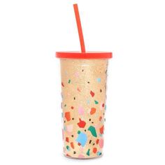 a cup with a straw and sprinkles on it