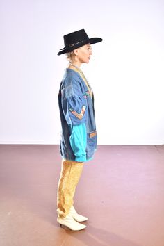 "Handmade SouthWest Denim Jacket/ HandPainted Pueblo Pottery/ Southwest Denim Coat/ Size M Puff shoulder with aqua sweatshirt sleeve and lining! This jacket is more than fun, someone put the love of culture into it. No tag, artist remains a mystery! Made out of Wrangler jeans, Wrangler tag on one of the pockets! Instantly turn a grey day alive with the sun and sky of the southwest, by simply wearing this jacket! I just love the aqua blue, the water, sacred especially in the desert! Measurements: Retro Blue Denim Vest For Fall, Hippie Long Sleeve Denim Outerwear, Pre-washed Long Sleeve Denim Jacket For Fall, Retro Acid Wash Long Sleeve Denim Jacket, Hippie Blue Denim Jacket, Denim Blue Jacket For Fall Festival, Blue Pre-washed Denim Jacket For Fall, Spring Pre-washed Blue Denim Jacket, Fall Blue Pre-washed Denim Jacket