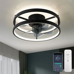 a room with a ceiling fan and remote control