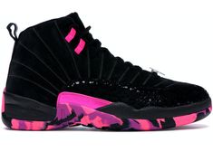 the nike air jordan xi is decorated with pink and black camouflage print on the upper part