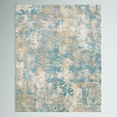 an abstract rug with blue, yellow and white colors