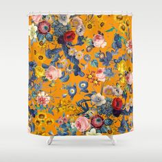 an orange shower curtain with colorful flowers on it