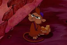 a cartoon monkey sitting on the ground holding a piece of bread in its hand and looking at it