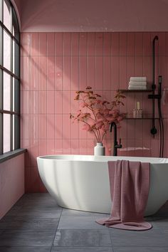 a bathroom with pink tiles and a white bathtub next to a flower vase on the floor