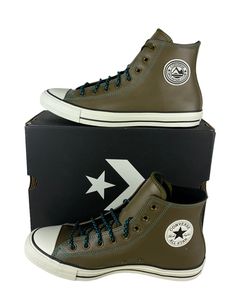 One pair of new in box adult unisex Converse Chuck Taylor All Star Hi Mountain Club Shoes/Sneakers (165957C). The color is Surplus Olive/Turbo Green/Egret, and the size is men's US 9 (fits women's US 11) (UK 9, EUR 42.5, CM 27.5). Specifications: Leather material upper Converse Mountain Club logo on outer ankle Converse Chuck Taylor All Star logo on outer ankle Egret colored outsole with black striping Converse All Star logo on back heel Black bottom  Extra set of rope laces  Shipping: We ship all items within 24 hours excluding weekends and bank recognized holidays. Returns: We accept domestic returns for this item within 30 days. New items returned in used condition will not be accepted. Questions? Feel free to message us. We will return your message promptly. Looking for more discounted Turbo Green, Club Shoes, Black Bottom, New Converse, Club Logo, Star Logo, Converse Chuck Taylor All Star, Black Bottoms, Converse All Star