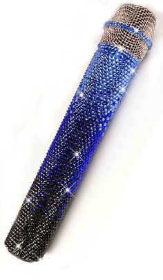 a blue and black beaded pen on a white background