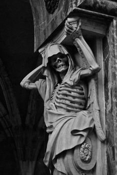 black and white photograph of a skeleton statue