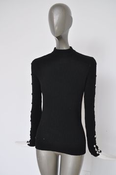 Great Miss Abercrombie wool sweater fitted, good pre-owned condition. In the back at neckline is a zipper. The sleeves on the side have gaps attached with buttons. No odors tears or holes. Small size please see measurements. Free domestic shipping, get 15% discount w code crazyfashion. Measures Length 23 inch Bust 30 inch total Sleevelength 23 inch sweater has a bit of stretch to it. Fitted High Neck Wool Sweater, Fitted Wool Sweater, Vintage Long Sleeve Stretch Sweater, Long Sleeve Wool Sweater With Button Cuffs, Winter Turtleneck Sweater With Buttons, Fitted Fall Sweater With Buttons, Wool Sweater With Button Cuffs, Fitted Wool Long Sleeve Sweater, Fitted Wool Sweater With Long Sleeves