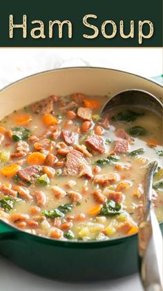 ham soup with carrots and spinach in a green pot on a white table