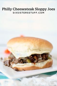 a close up of a sandwich on a plate with the words phily cheesesteak sloppy joes