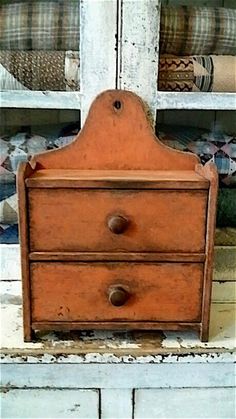 an old wooden dresser with two drawers