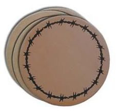 three brown plates with barbed wire on the top and one has a black circle at the center