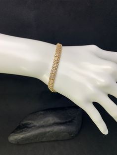 Gold tone sterling silver chain link bracelet with round  CZ's, Cubic Zirconias, with many stones. Stamped 925 DL. Favorite our shop, so you will be the first to see our new listings! ~Condition~ (Please see photos.) Excellent condition.  ~Size & Specifications~ Please see photos Weighs 15 grams Tested as 100% sterling silver Stamped:  925 DL Tests as 100% sterling silver All jewelry at Saved from the Fire has been hand-picked and rescued from pieces that were about to be melted away by gold and silver buyers forever.  We brought them back from melting and preserved them so that they can be treasured once again. More on our shop and process at: https://www.Etsy.com/Shop/SavedFromTheFire/About Because of the nature of their acquisition, each of our items is in the range from good to excelle Bracelet Butterfly, Tennis Bracelet, Sterling Silver Chain, Chain Link Bracelet, Hand Picked, The Fire, Gold And Silver, Sterling Silber, Link Bracelets