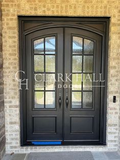 a black double door with two sidelights