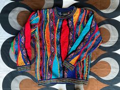 "Made in Brunswick, Australia by the co-creator of 3D knitwear for COOGI, GECCU continues this tradition of fine craftsmanship and wildly creative knitwear using fine Merino wool. Label: GECCU Style: VALLEY crew-neck jumper Size: S (Small) - available  - armpit to armpit 55cm / 21.5\" - length from back collar to base 65cm / 25.5\" - sleeve out seam 55cm / 21.5\" - sleeve inseam 43cm / 17\" Size L (Large) - available to order  Measurements - armpit to armpit 59cm / 23\" - length from back collar Multicolor Knitted Wool Sweater, Multicolor Wool Knit Sweater, Creative Knitwear, Coogi Sweater, Cotton Jumper, Crew Neck Jumper, Sweater Outfits, Merino Wool, Jumper