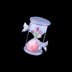 a pink vase with flowers in it sitting on top of a black background, surrounded by butterflies