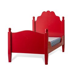 a red bed frame with scalloped headboard and foot board is shown in front of a white background