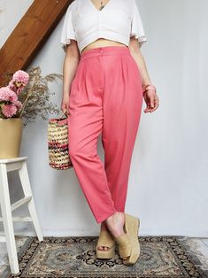 Vintage 90s pink high waist smart chino pants Soft and comfortable, nice trousers for this season! High elastic waist, pockets. Pants are in great vintage condition. SIZE. Model usually wears UK 10-12 / S-M / US 6-8, item could fit UK 10-12 / S-M / US 6-8. Please, see the measurements before buying. MEASUREMENTS: waist - 72 cm (when relaxed), hips - 114 cm, inside leg length - 61 cm. Item is from 50% viscose, 50% polyester. Care delicate. Color may differ slightly depending on the color calibrat Vintage Pink Pants For Summer, Retro High Waist Pink Pants, Vintage Pink Wide Leg Bottoms, Vintage Pink Wide Leg Pants, Retro Pink Pants With Pockets, Vintage Fitted Pink Pants, Vintage Pink Wide-leg Bottoms, Vintage Pink Cotton Pants, Pink Moisture-wicking Training Pants