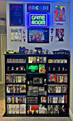 a video game room with several games on the shelves