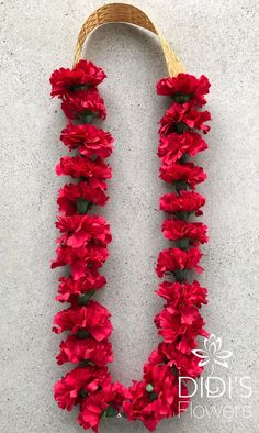 red flowers are arranged in the shape of a letter