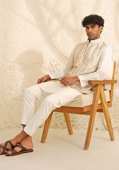 Introducing the sophisticated Ivory and Muted Gold Waistcoat Set. This ensemble features an ivory kurta with a Chinese collar and a concealed placket, paired with a refined waistcoat in muted gold and matching ivory pants. Ideal for puja ceremonies, engagements, Roka functions, or receptions, this set epitomizes elegance and style. Composition : Dupion Silk Care: Dry Clean Only and Vacuum Storage This product can be customized for sleeves, length and colour Delivery : 4-6 weeks as the product is hand crafted. Check Size Guide or choose MySize for free customisation (All Sizes above XL can be made at 15% additional cost) For more information and sizes please contact fabiliciousfashion@gmail.com or visit our Copenhagen studio. About the Designer : Shreyansh, a distinguished designer label sp Elegant Beige Bandhgala For Designer Wear, Elegant Cream Nehru Jacket For Designer Wear, Elegant Designer Wear Off White Bandhgala, Elegant Designer Off White Bandhgala, White Elegant Nehru Jacket For Designer Wear, Elegant Off-white Designer Bandhgala, Elegant White Nehru Jacket For Designer Wear, Cream Festive Bandhgala For Semi-formal Occasion, Elegant Cream Sherwani For Semi-formal Occasions