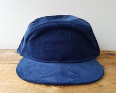 Snap on this vintage new navy blue blank 5 panel corduroy hat with adjustable snapback. Made by KP Caps. Adjustable snap - One Size Fits Most (up to hat size 7 5/8) Condition: Deadstock. New, Never Worn Checkout all our corduroy hats! Click here: https://www.etsy.com/shop/HatsForward?ref=seller-platform-mcnav&search_query=corduroy ..whenever you're purchasing multiple hats we automatically combine shipping costs to save you more! Blank Hats, Style Baseball Cap, Blue Corduroy, Cotton Gifts, Felt Hat, Snapback Cap, Ball Cap, Hat Sizes, Snapback Hat