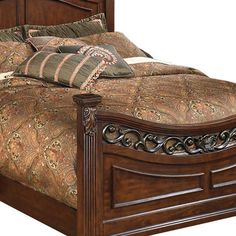 a bed with wooden headboard and foot board on top of it's frame