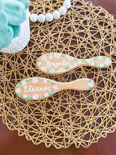 two wooden spoons sitting on top of a doily