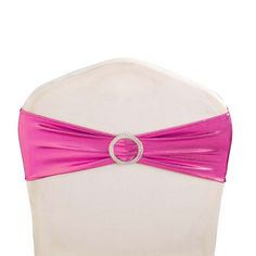 the back of a white chair with a pink sash on it's headband