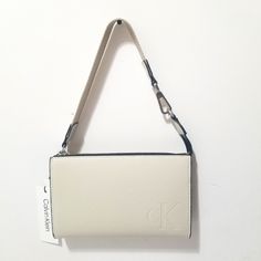 Calvin Klein Wristlet Modern Essentials Shoulder Bag Color Jasmine White Polyrethane W 8"1/4 - H 5"1/8 -1"1/2 Formal Rectangular Bag With Wrist Strap, Classic Evening Bag With Wrist Strap, Jasmine White, Calvin Klein Bags, Calvin Klein Bag, Womens Calvin Klein, Clutches, Calvin Klein, Dancer