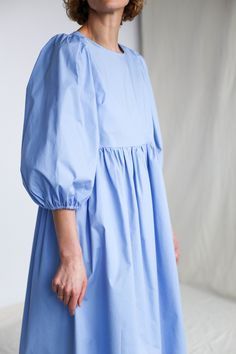 "Puffy sleeve cotton dress in sky blue color. Perfect for any occasion or to wear every day. - Handmade in our studio from 97% cotton 3% spandex - Relaxed fit - Crew neckline - Half-length puffed sleeves - Side slip pockets - Full A-line skirt - Straight, midi hem FABRIC&CARE Cotton Hand wash or gently machine washable 30C, hang dry recommended, iron on reverse. SIZE&FIT Simona is wearing XS size and is 172 cm/5'8\" tall. SIZE XXS *BODY: Bust: fits bust around 32\"-33\"/ 82-84 cm Waist: Cotton Mini Dress With Puff Gathered Sleeves, Cotton Dresses With Relaxed Fit, Relaxed Cotton Mini Dress For Daywear, Relaxed Fit Cotton Mini Dress For Daywear, Summer Cotton Mini Dress With Gathered Sleeves, Cotton Knee-length Mini Dress With Gathered Sleeves, Knee-length Cotton Mini Dress With Gathered Sleeves, Casual Cotton Puff Sleeve Dress For Daywear, Summer Cotton Dress With Gathered Sleeves