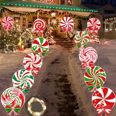 a house decorated for christmas with candy canes