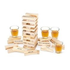 a stack of wooden blocks and glasses filled with liquid sitting on top of each other