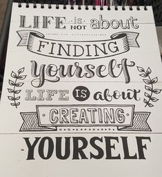 a spiral notebook with an inspirational quote on the front and back cover that says, life is not about finding yourself it's about life is about creating yourself