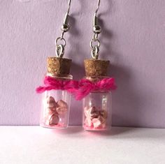 These earrings are (about 1 inch) jars that contain 5 hand folded miniature paper stars and a sprinkle of glitter with a matching painted rim (or bow) Stars In A Jar, Jar Earrings, Paint Matching, Paper Stars, In A Jar, Sprinkles, Jewelry Earrings Dangle, 1 Inch, Etsy Earrings