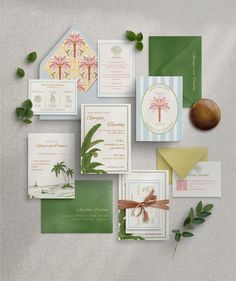 the wedding stationery is laid out on top of each other, including cards and envelopes