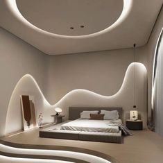 a large bed sitting in the middle of a bedroom under a circular light above it