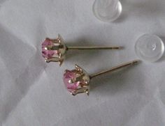 14K Pink Stone Stud Yellow Gold Earrings Vintage Karat KT Solid Pierced Post Materials: 14K solid gold metal marked (14K), (pink stones - do not know what they are made from) with plastic/silicone post backs Condition: excellent vintage Measures - 5mm x 5mm x 4mm Maker's mark - P Questions welcome. Pink Earrings With Prong Setting For Anniversary, Pink Prong Set Earrings For Anniversary, Classic Pink Hallmarked Earrings, Pink Birthstone Round Earrings, Pink Round Birthstone Earrings, Pink Wedding Earrings With Birthstone, Pink Round Earrings With Prong Setting, Sterling Silver Pink Birthstone Earrings, Pink Sterling Silver Birthstone Earrings