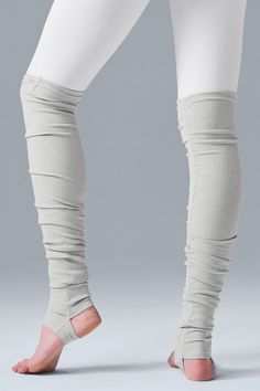 Engineered to move. Easy to layer. Made from the same soft, ribbed, move-with-you performance fabric as our best-selling Goddess Leggings, the Goddess Leg Warmers wear over-the-knee with a leotard or shorts or layered with leggings for extra warmth. Engineered stirrups fit comfortably under the heel or tucked up around the ankle. Sweat-wicking technology. Stirrups keep them in place; wear over the heel or at the ankle 4-way stretch fabric for a move-with-you feel Wear-tested by our in-house team Leg Warmer, Woman Back, Stirrups, Back Women, Dove Grey, 4 Way Stretch Fabric, The Goddess, Alo Yoga, Performance Fabric