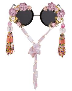 These dramatic floral Funglasses will make you feel ultra fabulous- the compliments are guaranteed OFF THE CHARTS! These plastic frames have round shaped dark tinted lenses and feature an all-over hand embellished frame with assorted fabulous purple and gold floral accents. To add an extra bit of flair, these Funglasses feature eye catching beaded tassels at each temple. Each pair is one-of-a-kind and as unique as you are. As if it couldn't get anymore fabulous, these Funnies are complete with a Bohemian Sunglasses For Summer Parties, Party Sunglasses With Round Glass Frame, Party Round Frame Glass Sunglasses, June Birthstone Jewelry, Zodiac Jewelry, Neck Chain, Gifts For New Mums, Men's Jewelry Rings, Pearl Jewellery Earrings