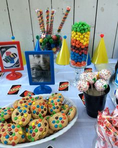 a table topped with lots of cookies and candy