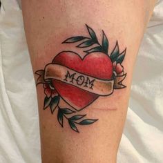 a heart tattoo with the word mom on it