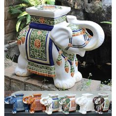 an elephant figurine with many different designs on it