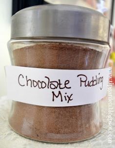 a jar filled with chocolate pudding mix on top of a table