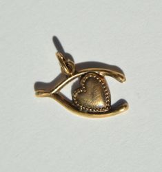 "A lovely vintage Midcentury era c1950s 14K yellow gold wishbone heart good luck charm talisman. Charm weighs 1.11 grams. Measures 3/4\" long at widest point across, or 19mm. Marked and tested as solid 14K gold. In excellent condition. Arrives in a sleek black logo gift box." Gold Tiger Eye, Almandine Garnet, Logo Gifts, Luck Charm, Luck Charms, Antique Jewellery, Black Logo, Heart Charm, Vintage Gold