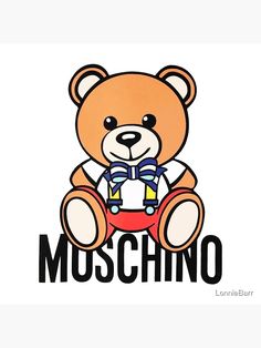 a brown teddy bear sitting on top of the word moschino with a bow tie