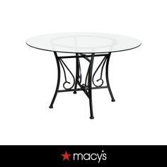 a glass table with metal legs and a star on the bottom, in front of a white background