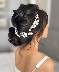 a woman wearing a bridal hair comb