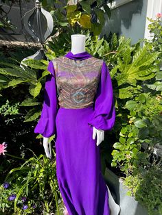 "Vintage 1970s Rich Purple Maxi Dress Beautiful Vintage Piece Floor Length  Glittery Paisley Panel on Bodice Made of Glittery Thread Jobi Brand  Bat Wing Sleeves with Elasticated Cuffs Zip Fastening Made of Polyester Measurements Marked Size 42 Bust - 38\" Waist - 30\" Hips - 42\" Length - 55\" Sleeve - 25\"" Wing Sleeves, Purple Maxi, Dress High Neck, Purple Maxi Dress, Brand Dress, Paisley Print Dress, Rich Purple, Dress Evening, Dress Clothes For Women