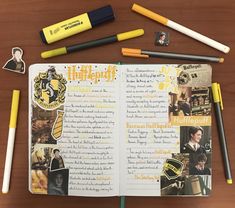 an open harry potter notebook with markers and pencils next to it on a table